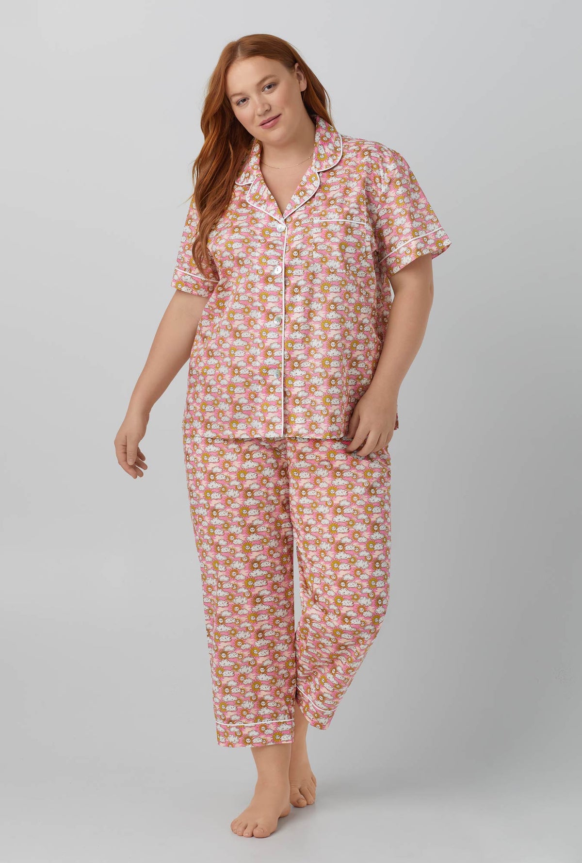 A lady wearing Follow The Sun Short Sleeve Classic Woven Cotton Tana Lawn® Cropped PJ Set Made with Liberty Fabrics