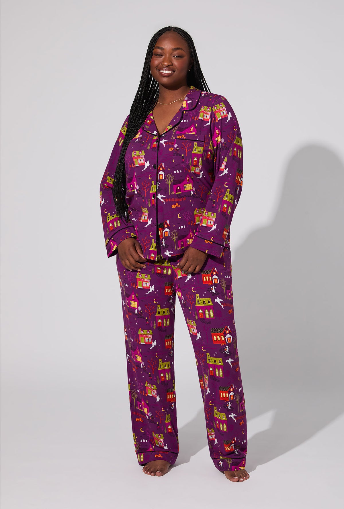 A lady wearing Spooky Town USA Long Sleeve Classic Stretch Jersey PJ Set