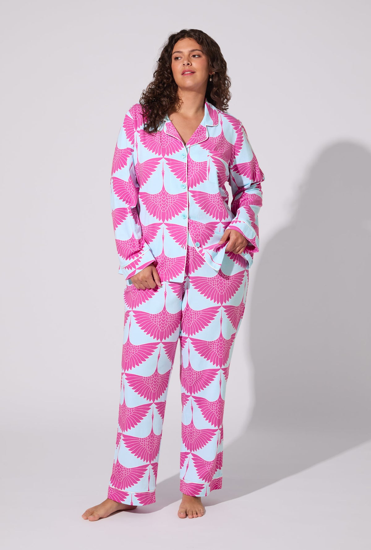 A lady wearing BedHead X Trina Turk Cranes Long Sleeve Classic Stretch Jersey PJ Set