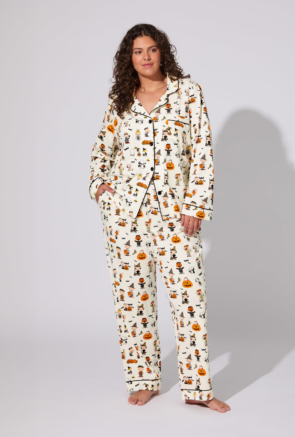 A lady wearing Peanuts® Snoopy&#39;s Halloween Long Sleeve Classic Stretch Jersey PJ Set