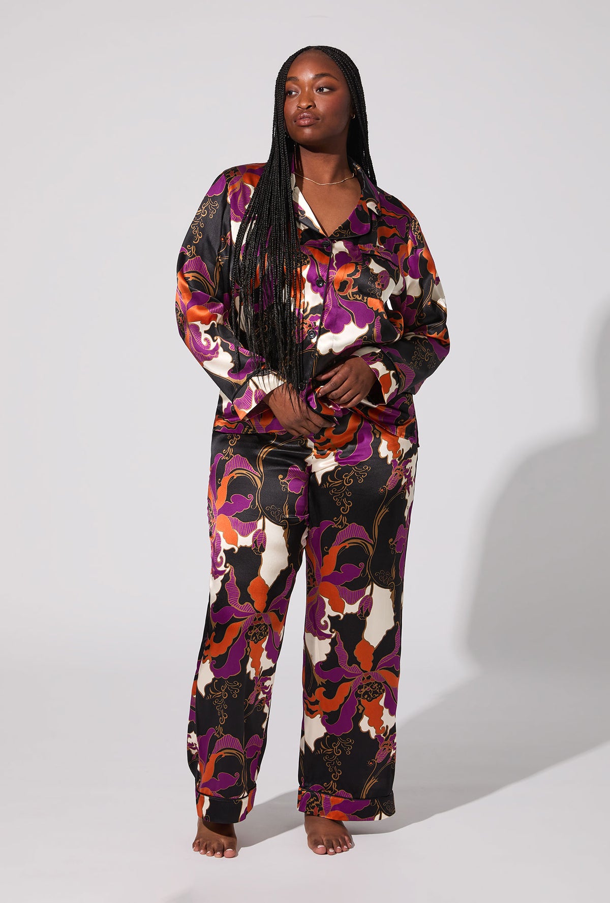 A lady wearing BedHead X Trina Turk Fall Floral Long Sleeve Classic Washable Silk PJ Set