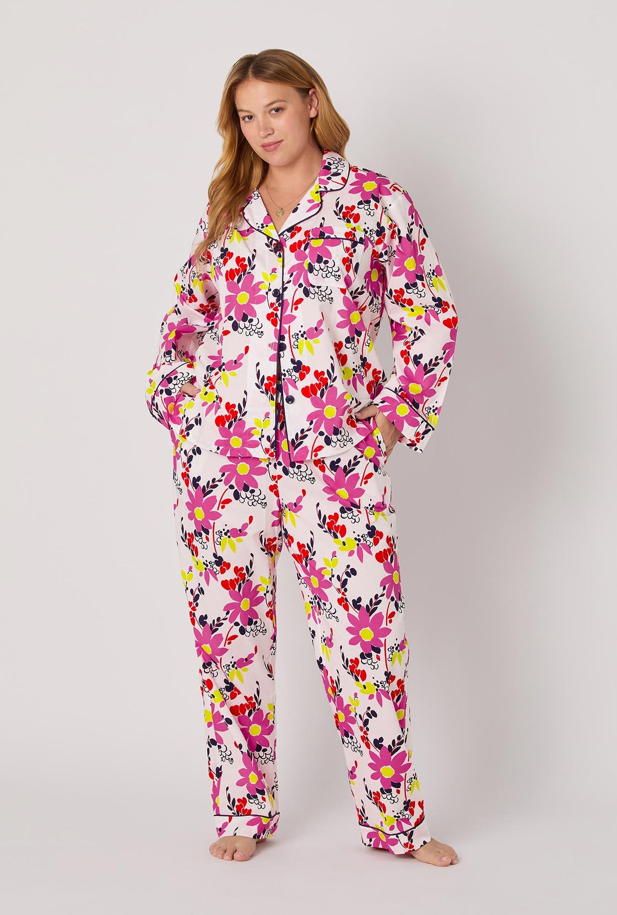 A lady wearing BedHead x Trina Turk Whimsical Floral Long Sleeve Classic Woven Cotton Poplin Pj Set