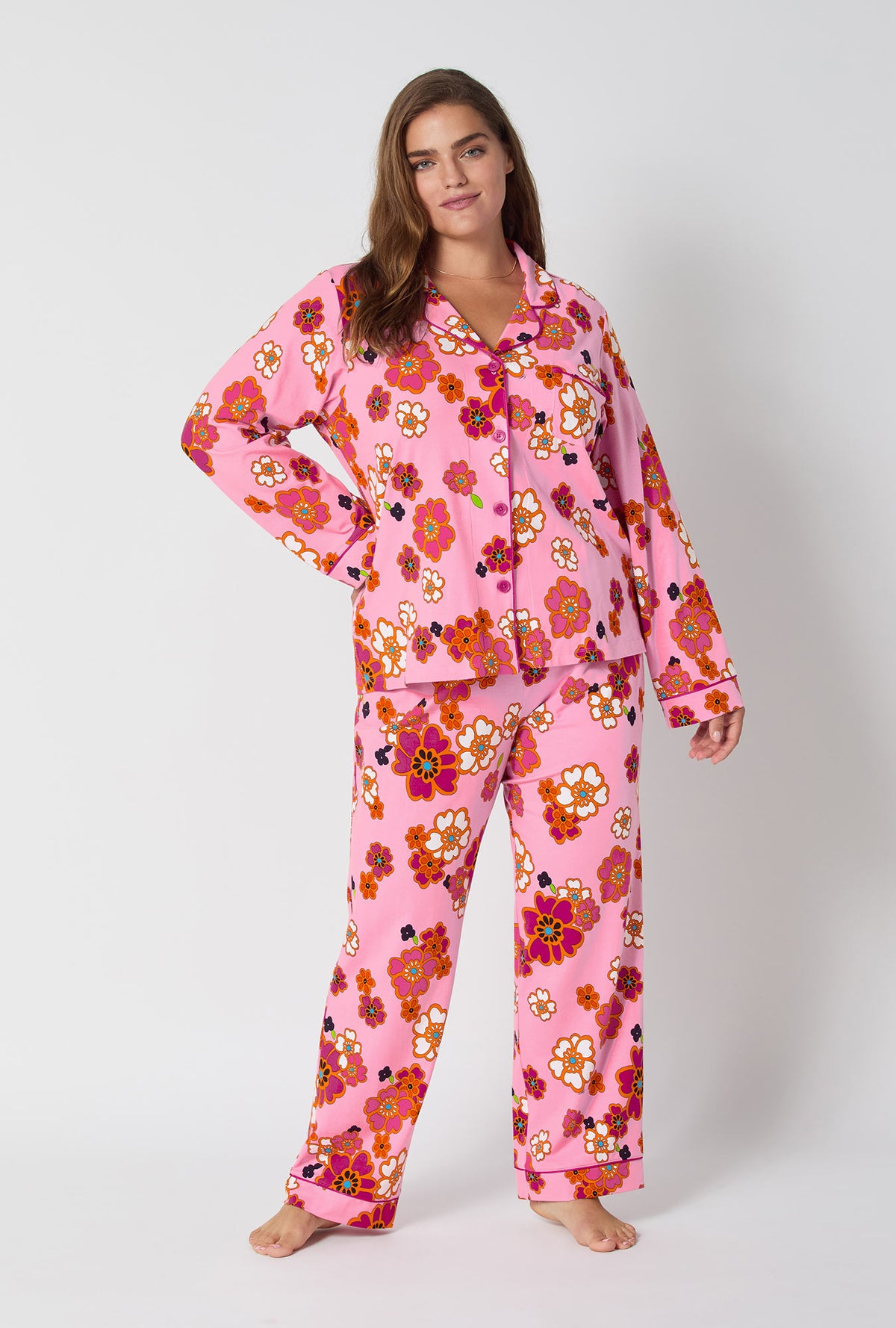 A lady wearing BedHead x Trina Turk Resort Floral Long Sleeve Classic Stretch Jersey Pj Set