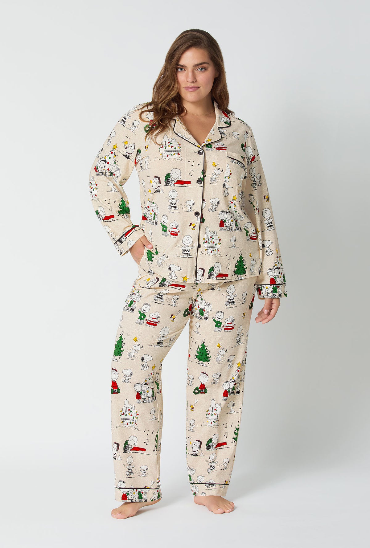 A lady wearing Peanuts® Celebration Long Sleeve Classic Stretch Jersey Pj Set
