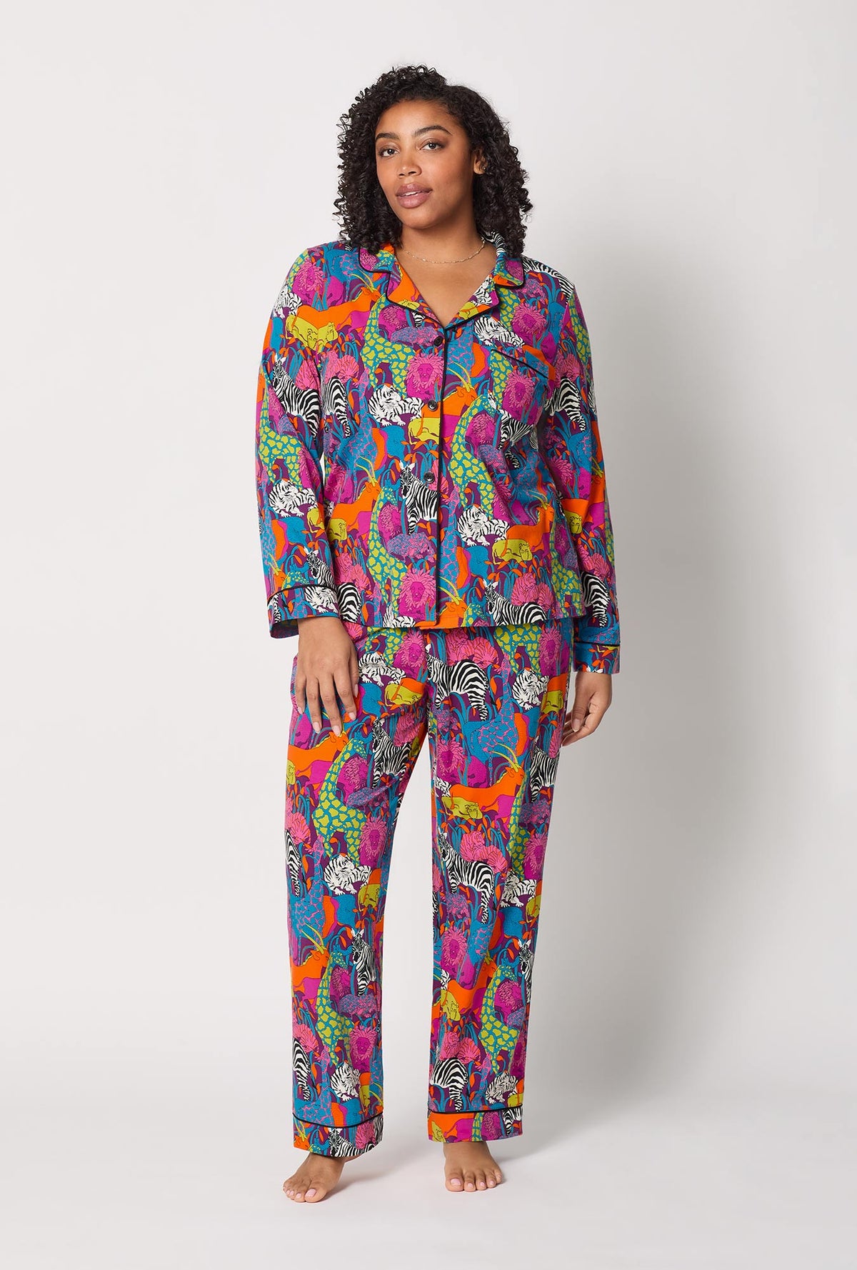 A lady wearing plus size BedHead x Trina Turk Jungle Long Sleeve Classic Stretch Jersey Pj Set