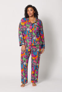 A lady wearing plus size BedHead x Trina Turk Jungle Long Sleeve Classic Stretch Jersey Pj Set