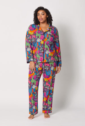 A lady wearing plus size BedHead x Trina Turk Jungle Long Sleeve Classic Stretch Jersey Pj Set