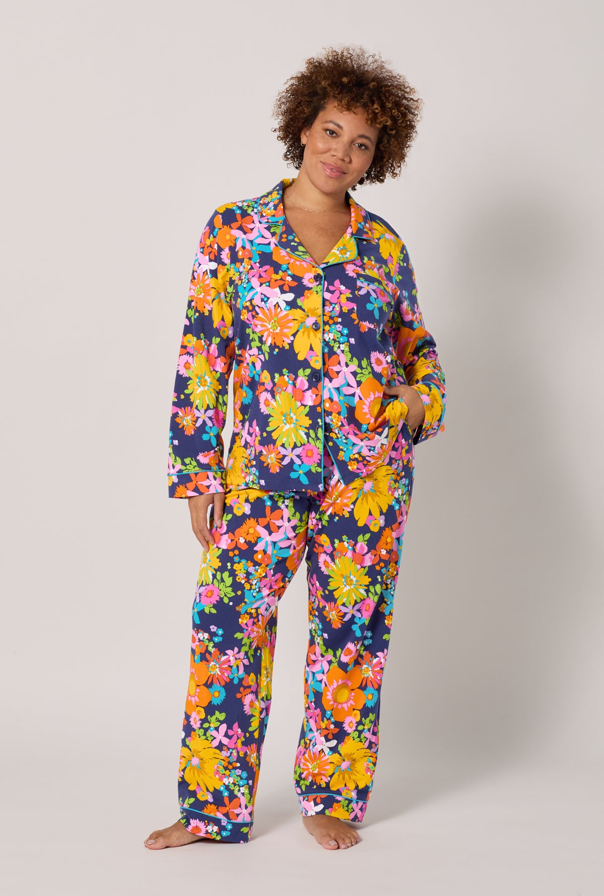 A lady wearing plus size BedHead x Trina Turk Bay Street Bloom Long Sleeve Classic Stretch Jersey Pj Set