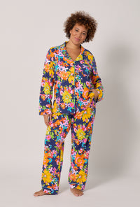 A lady wearing plus size BedHead x Trina Turk Bay Street Bloom Long Sleeve Classic Stretch Jersey Pj Set