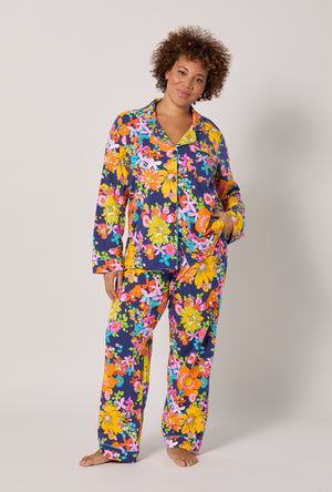 A lady wearing plus size BedHead x Trina Turk Bay Street Bloom Long Sleeve Classic Stretch Jersey Pj Set