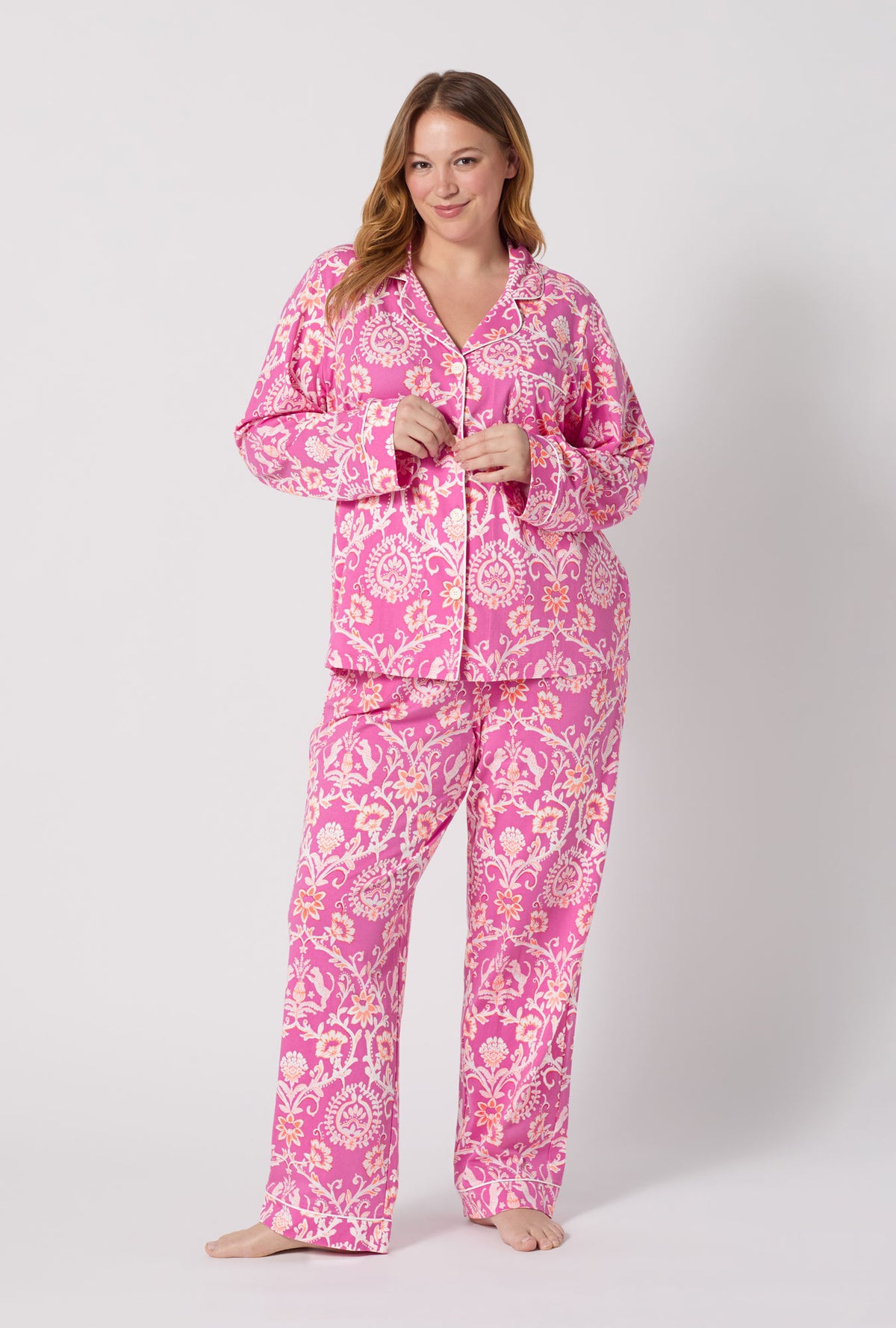 A Lady Wearing Plus Size Luxe Leopard Long Sleeve Classic Stretch Jersey Pj Set posing in a front view look with a smile on her face