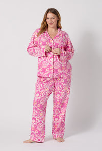 A Lady Wearing Plus Size Luxe Leopard Long Sleeve Classic Stretch Jersey Pj Set posing in a front view look with a smile on her face