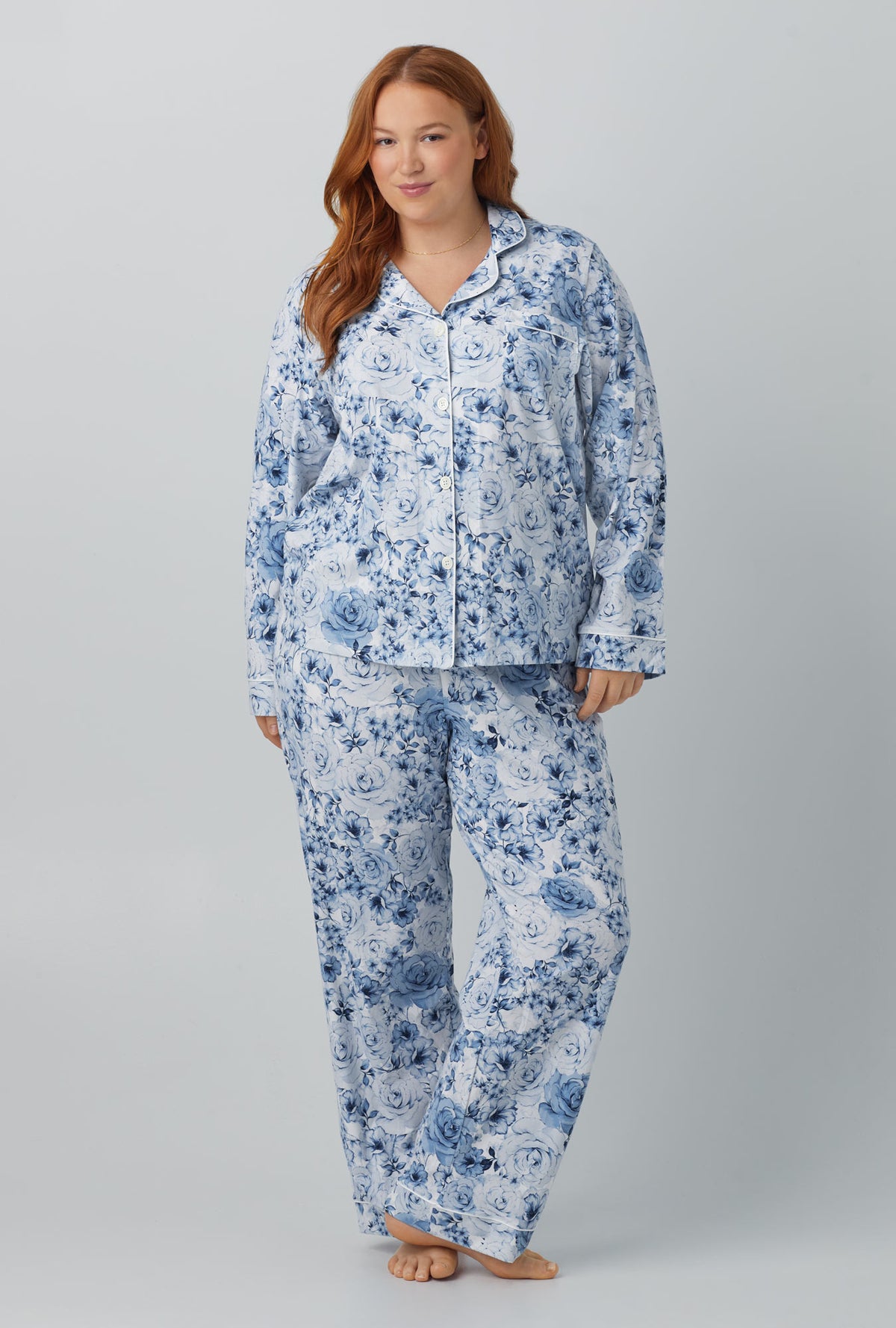 A lady wearing blue long sleeve classic stretch jersey cropped pj set with eternal blooms print.
