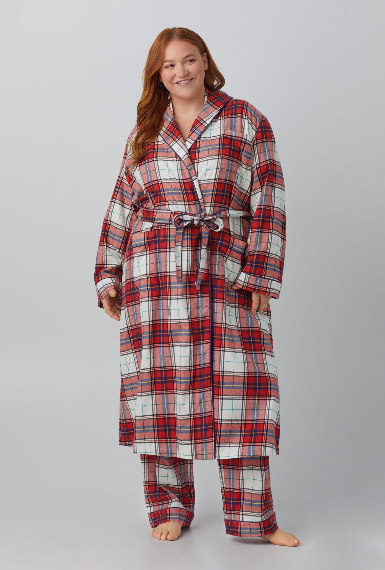 A man wearing Unisex Classic Woven Cotton Portuguese Flannel Robe de Chambre with Festive Tartan print