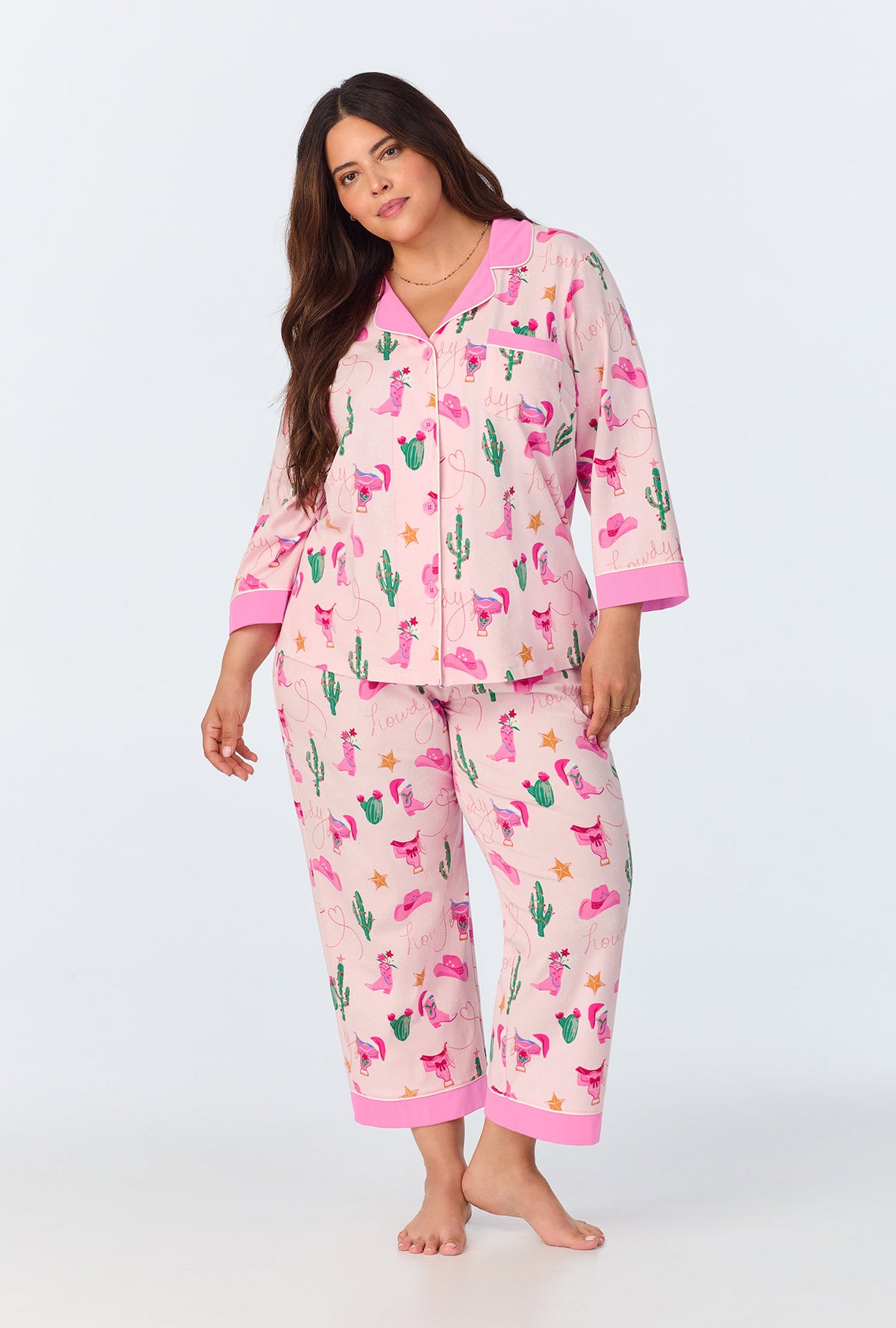 A lady wearing Christmas Cowgirl 3/4 Sleeve Classic Stretch Jersey Cropped PJ Set