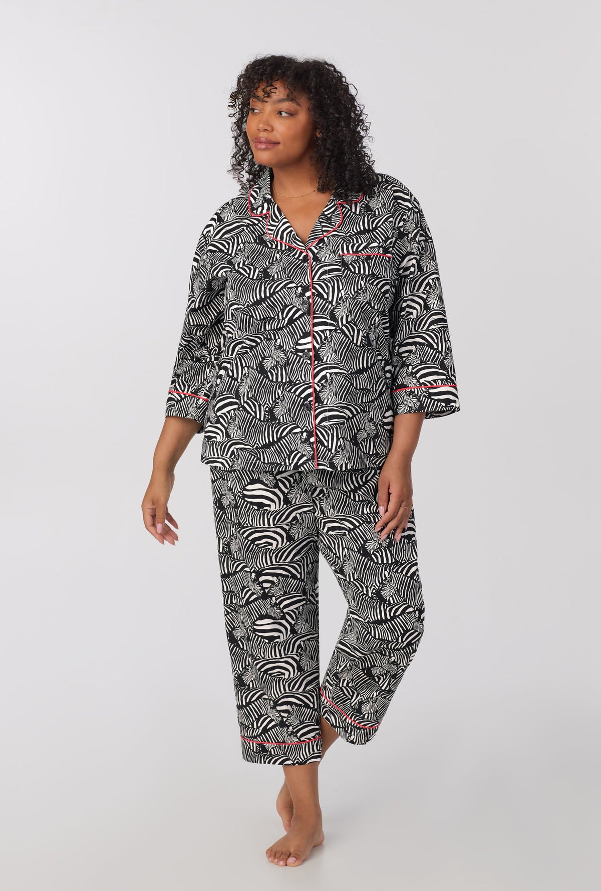 A lady wearing plus size  quarter Sleeve Classic Woven Cotton Cropped PJ Set with  Zebra Safari print