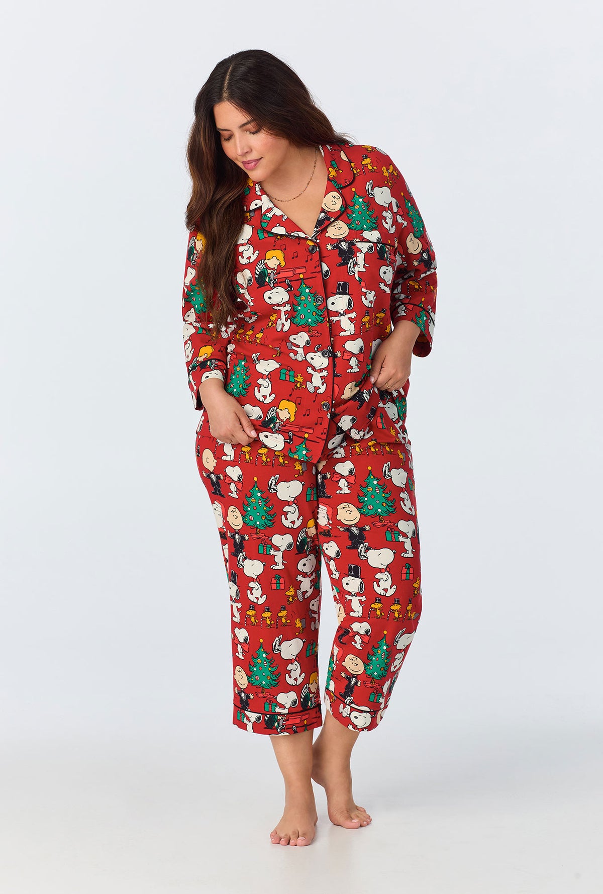 A lady wearing Peanuts® Festive Fun 3/4 Sleeve Classic Stretch Jersey Cropped PJ Set
