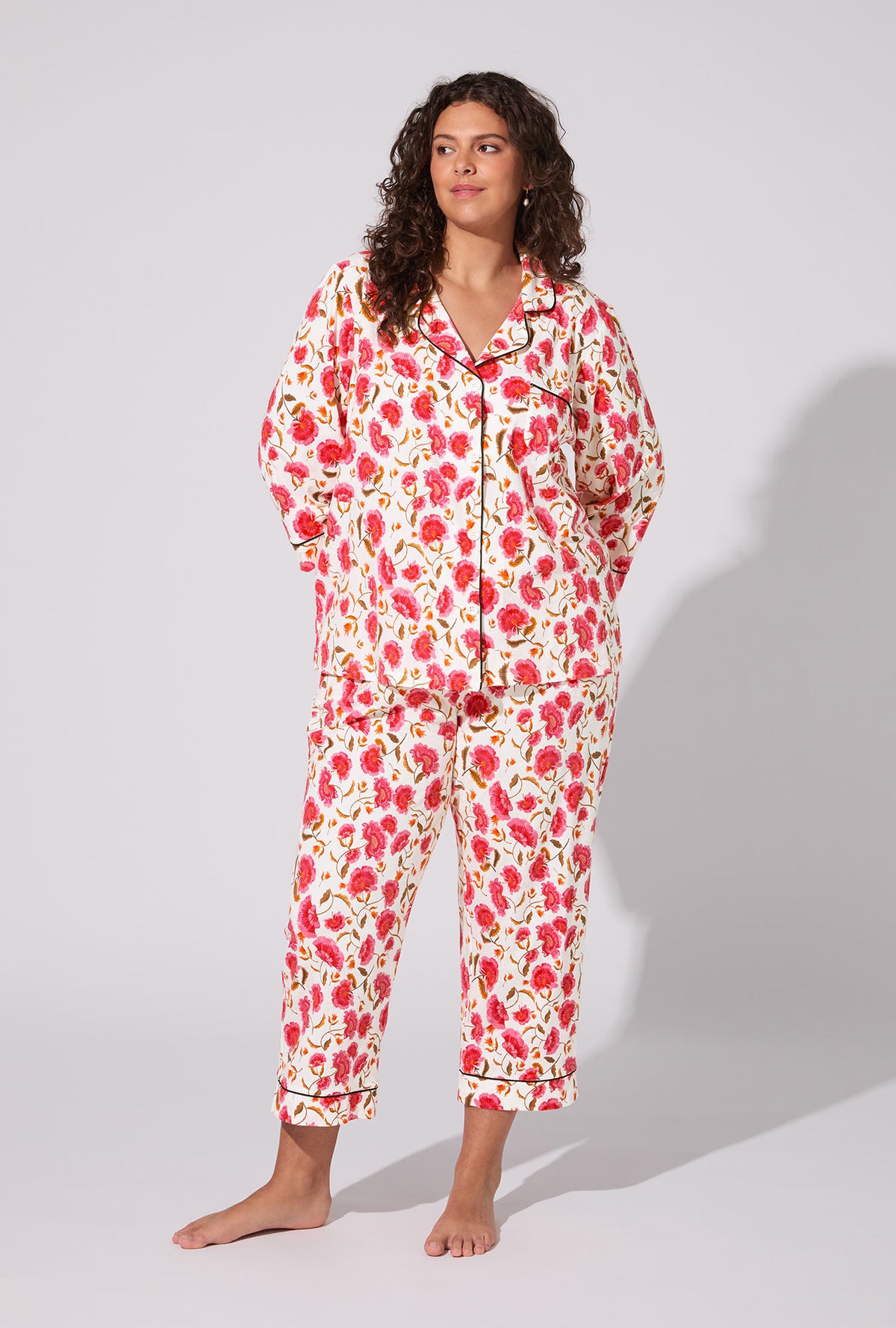 A lady wearing Fantasia Floral 3/4 Sleeve Classic Stretch Jersey Cropped PJ Set