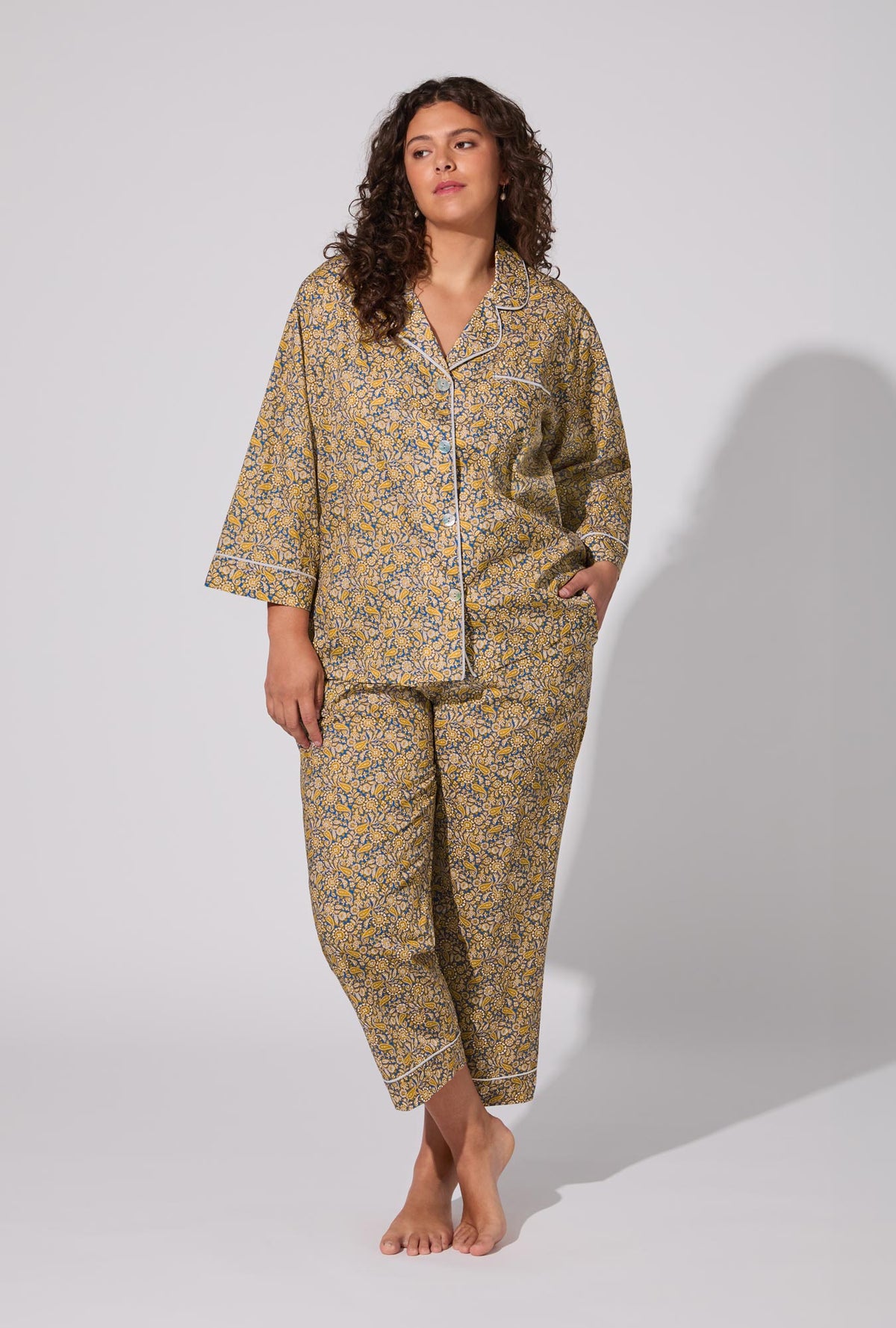 A lady wearing Theodore Manor 3/4 Sleeve Classic Woven Tana Lawn® Cropped PJ set Made With Liberty Fabric