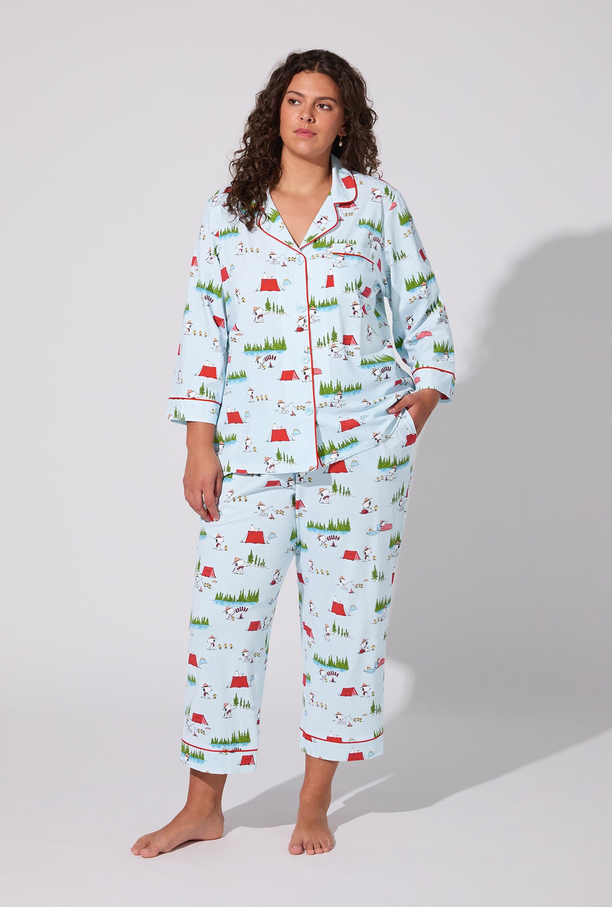 A lady wearing Peanuts® Camp Snoopy  3/4 Sleeve Classic Stretch Jersey Cropped PJ Set