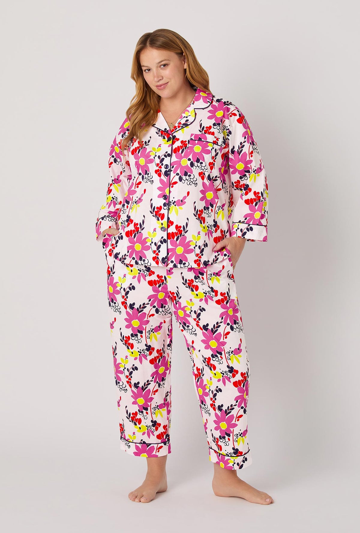 A lady wearing BedHead x Trina Turk Whimsical Floral 3/4 Sleeve Classic Woven Cotton Cropped Pj Set
