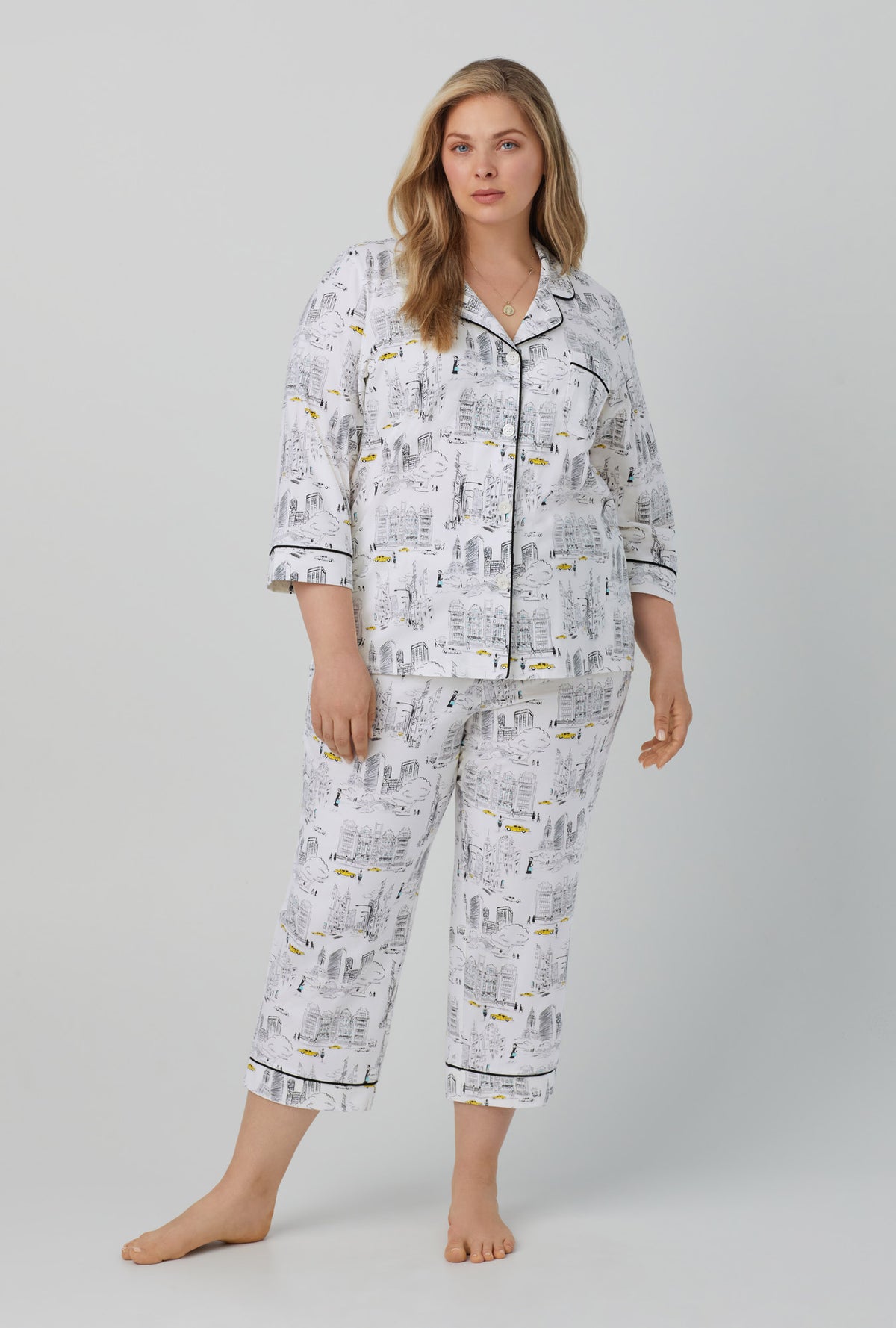 A lady wearing white  3/4 Sleeve Classic Stretch Jersey Cropped PJ Set with City That Never Sleeps  print