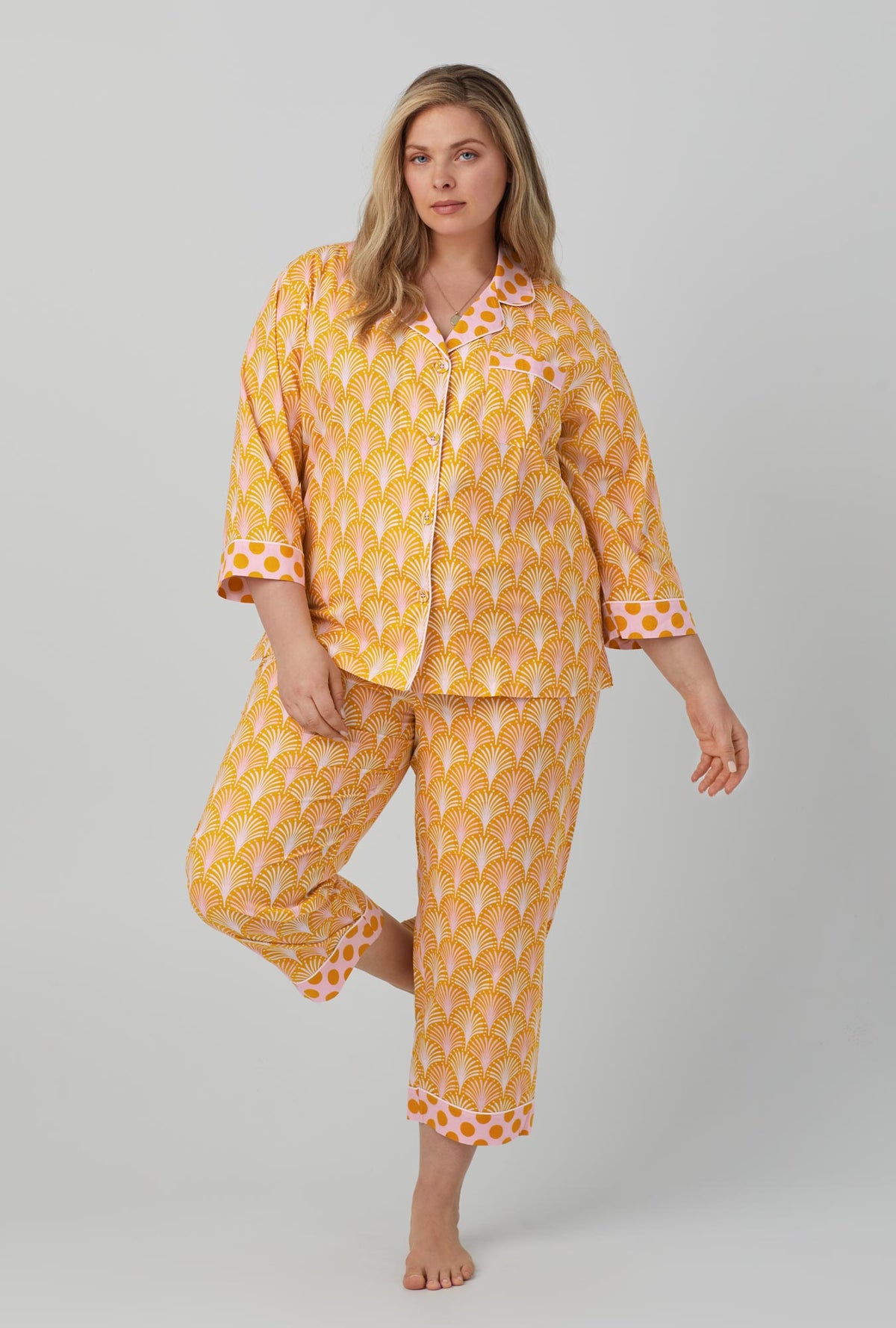 A lady wearing 3/4 sleeve classic woven cotton cropped pj set with suite life print