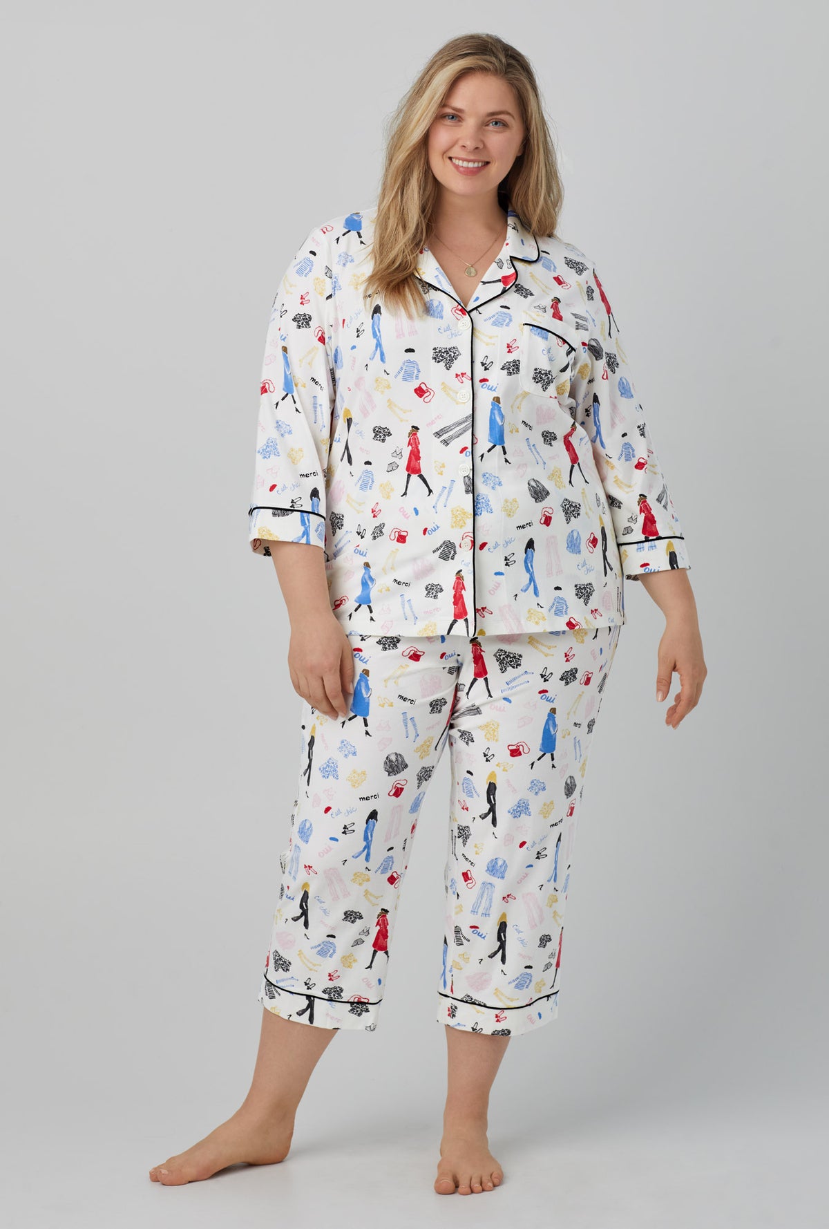 A lady wearing white 3/4 Sleeve Classic Stretch Jersey Cropped PJ Set with Cest Chic print