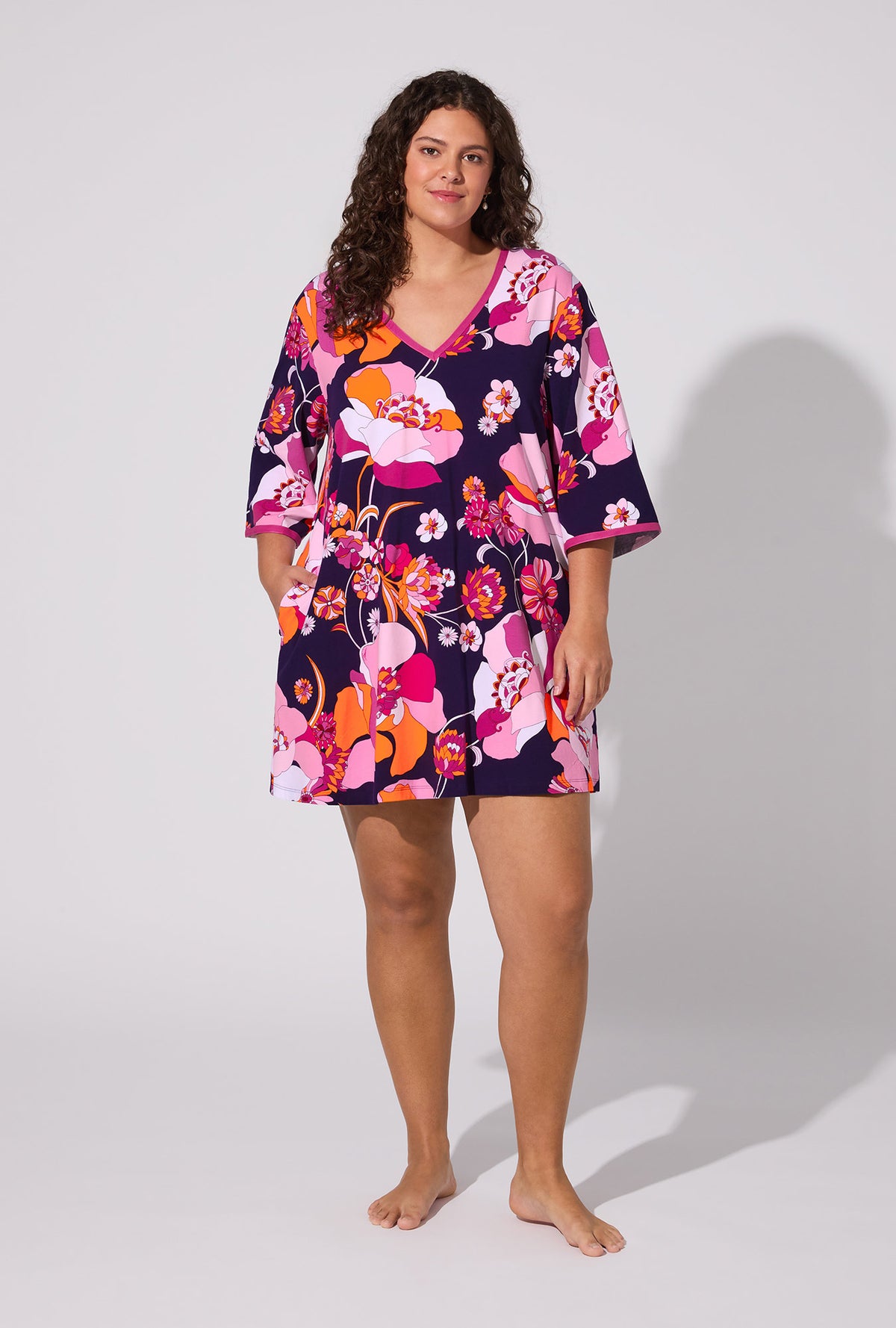 A lady wearing BedHead X Trina Turk Floral Medley 3/4 Sleeve Stretch Jersey Caftan