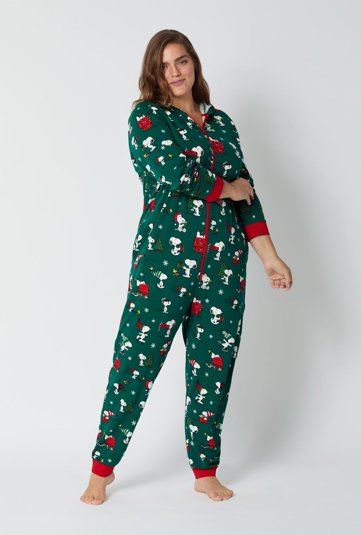 A lady wearing ®Snoopy's Holiday Fun Long Sleeve Stretch Jersey Unisex Onesie