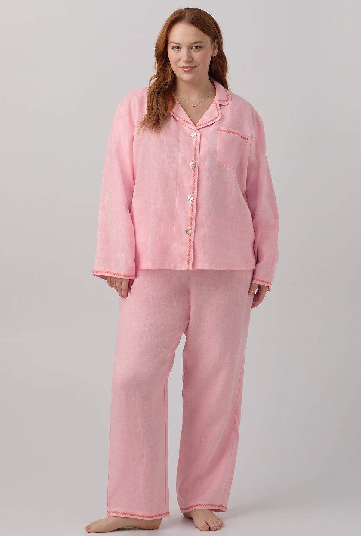 A lady wearing plus size pink Long Sleeve Classic Linen PJ Set with Orchid Pink print.