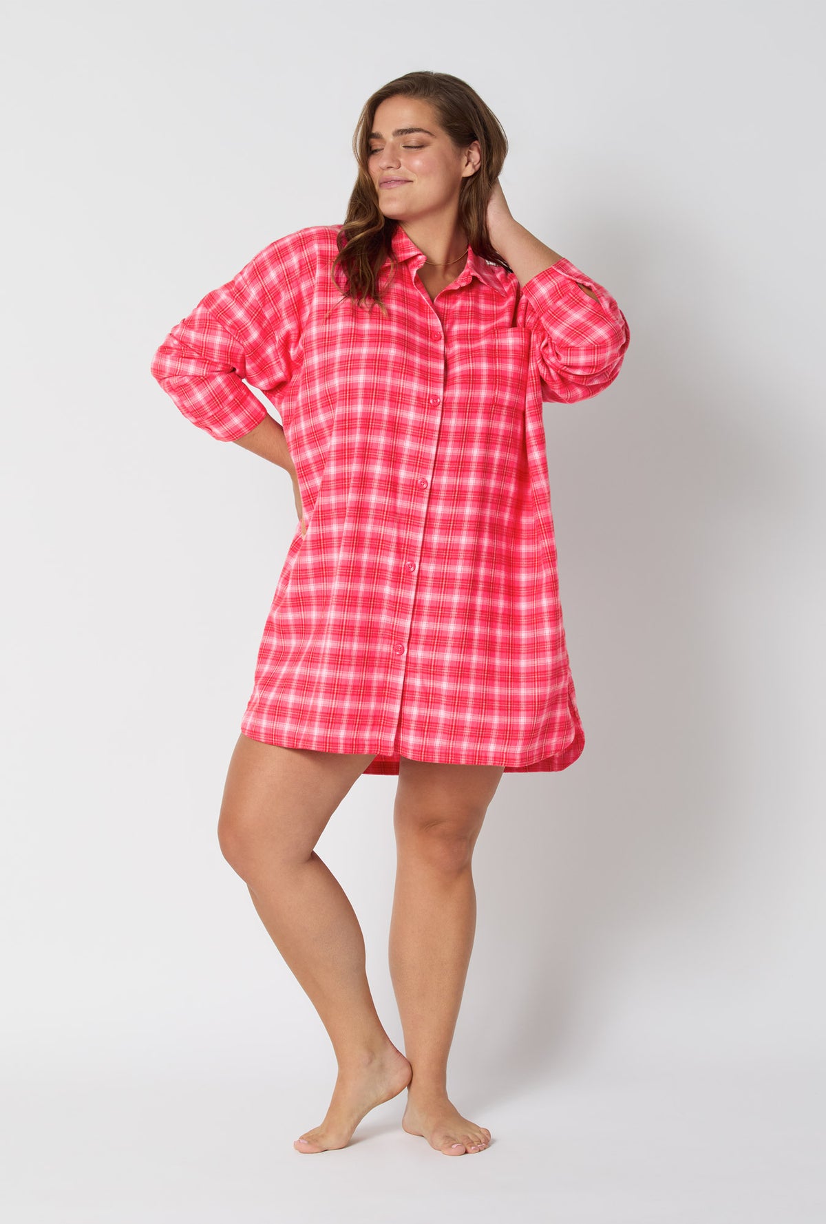 A lady wearing Wonderland Plaid High Low Woven Portuguese Flannel Boyfriend Shirt