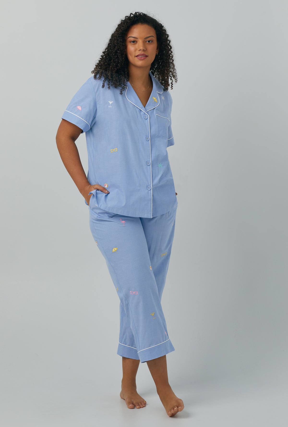 A lady wearing plus size blue Short Sleeve Classic Woven Cotton Poplin Cropped PJ Set with Chambray print