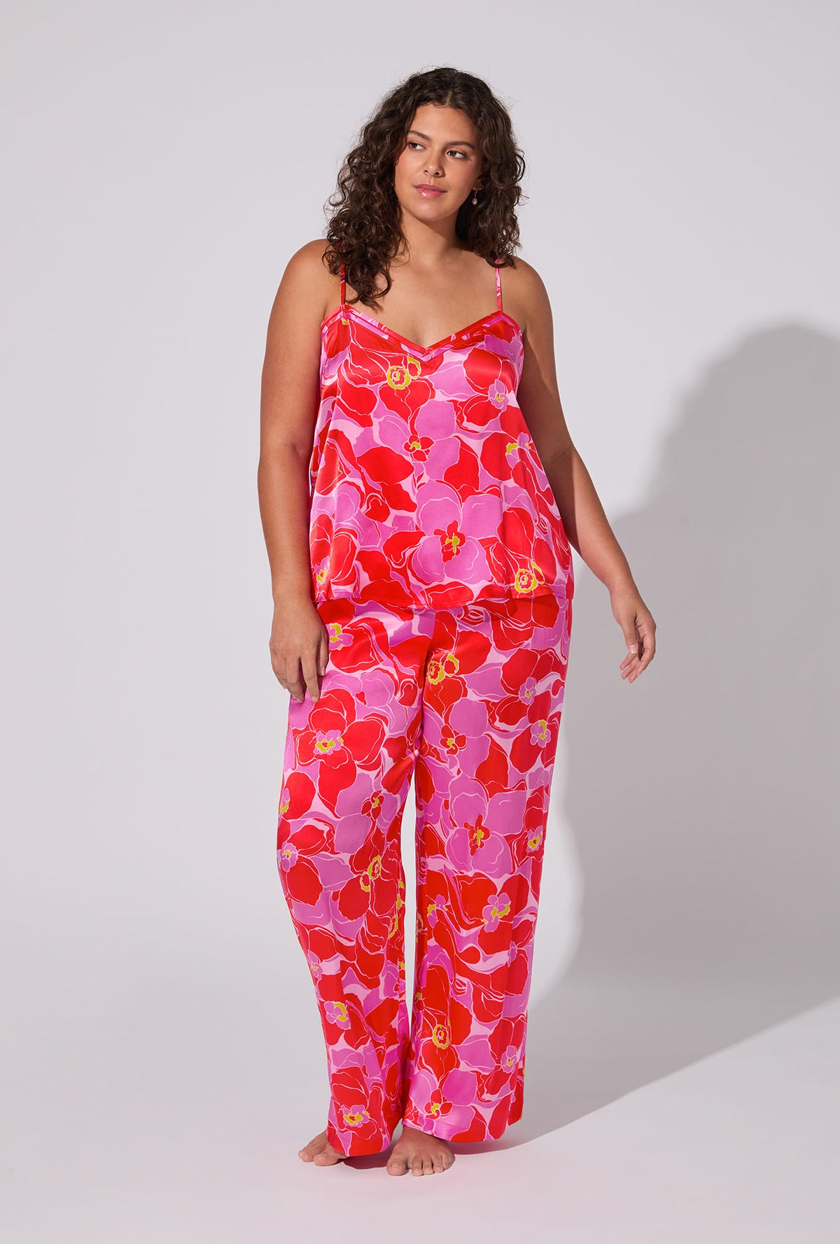 A lady wearing BedHead X Trina Turk Winter Orchids Cami Tank Woven Washable Silk Long plus PJ Set