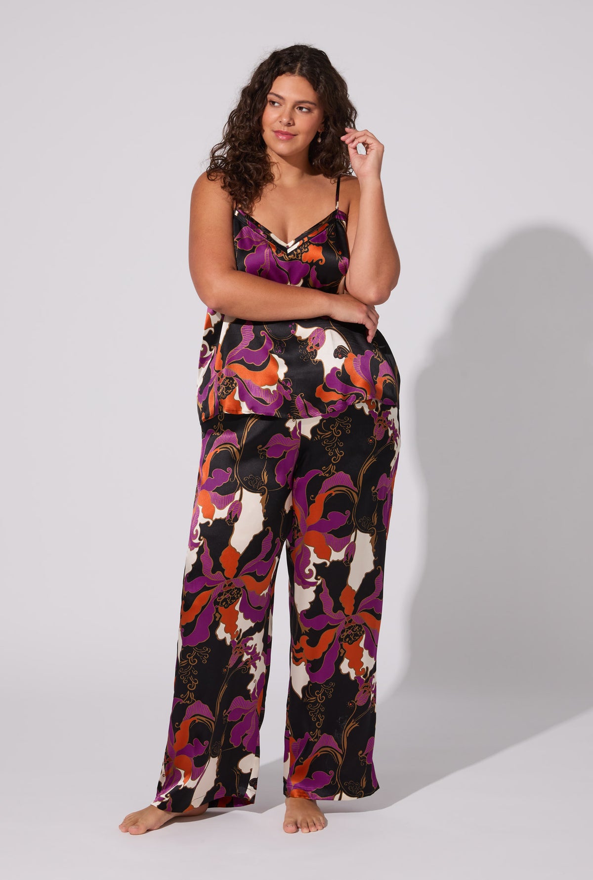 A lady wearing BedHead X Trina Turk Fall Floral Cami Tank Woven Washable Silk Long PJ Set
