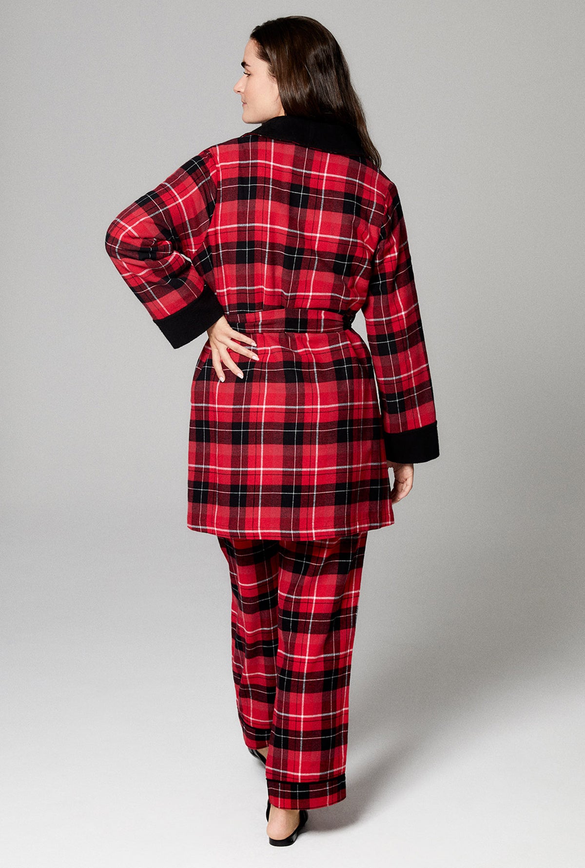 A lady wearing red long sleeve french terry woven cotton flannel robe with nicholas plaid print.