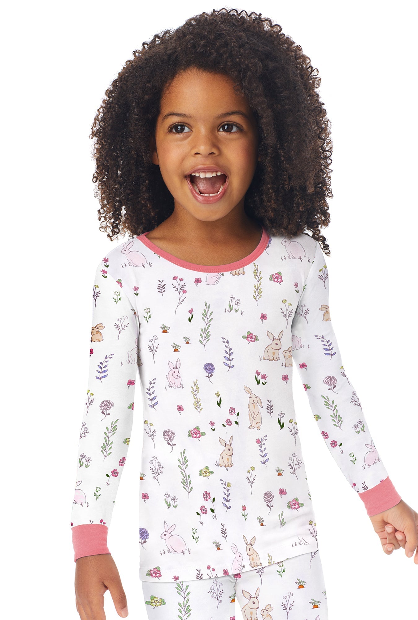 A kid wearing a white long sleeve pj set with hares pattern.
