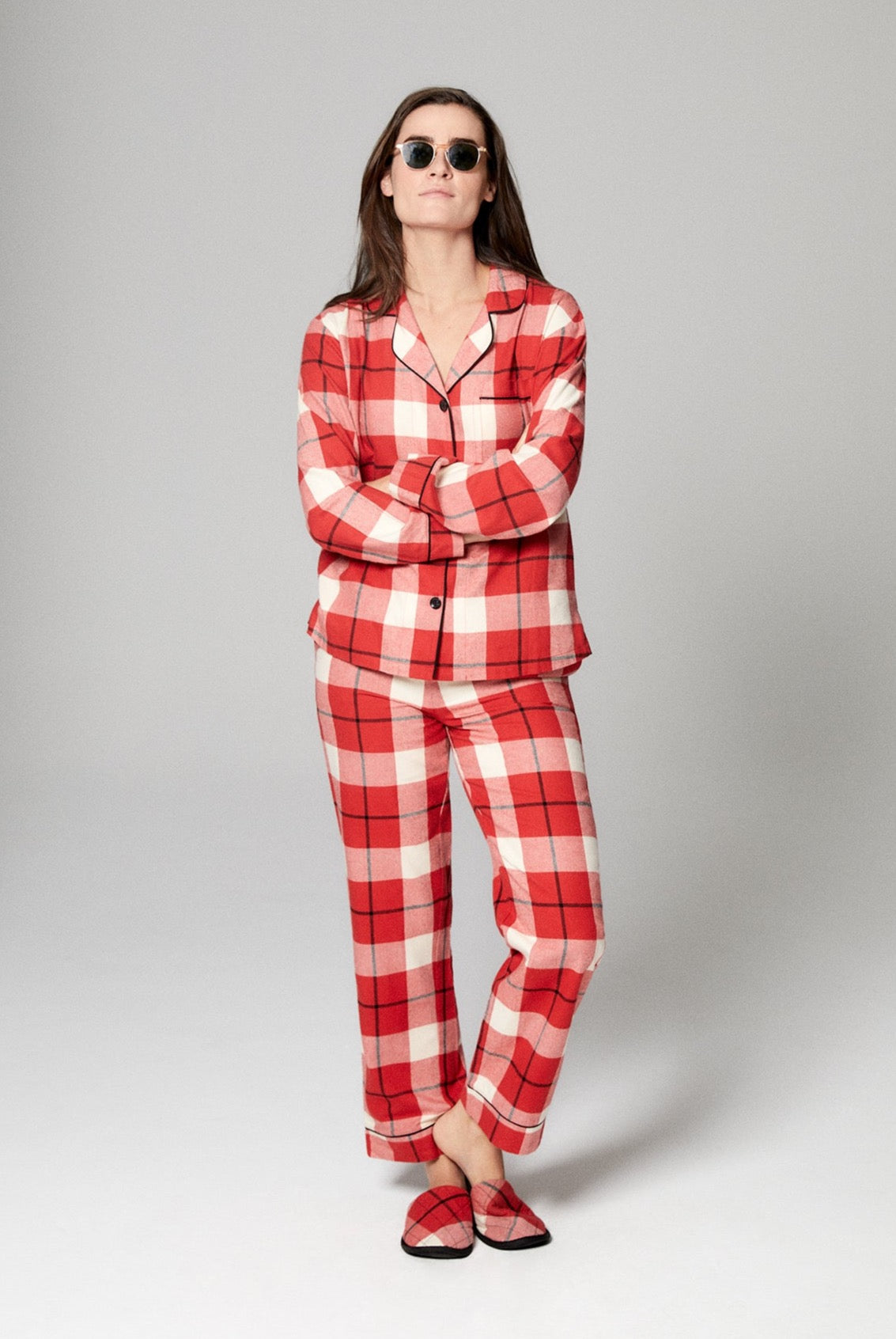 A lady wearing red long sleeve classic woven cotton portugese flannel pj set with country plaid.