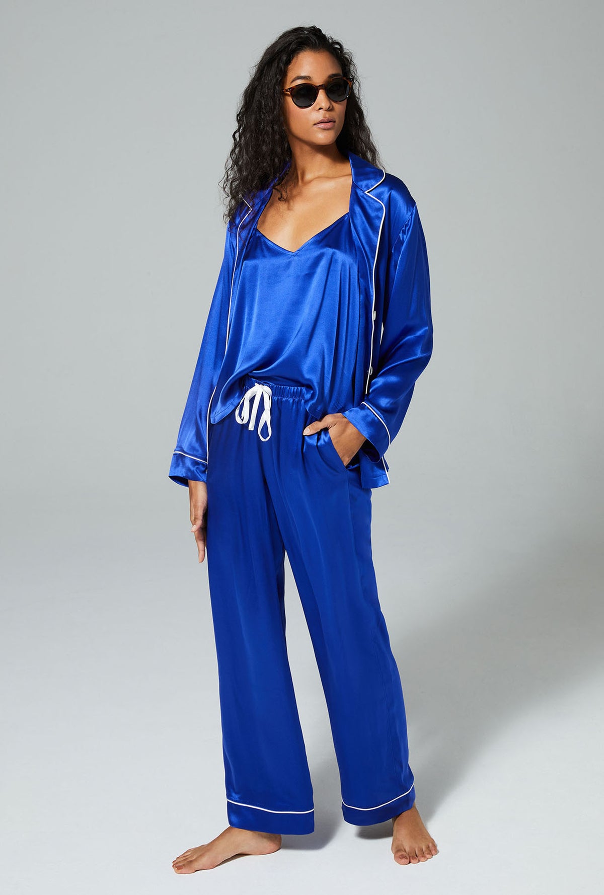 A lady wearing blue long sleeve 3 piece classic pj set 