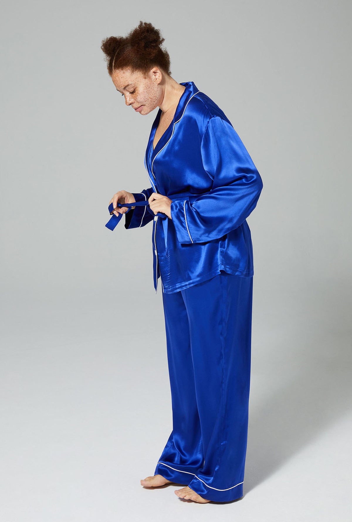 A lady wearing blue long sleeve 3 piece classic pj set