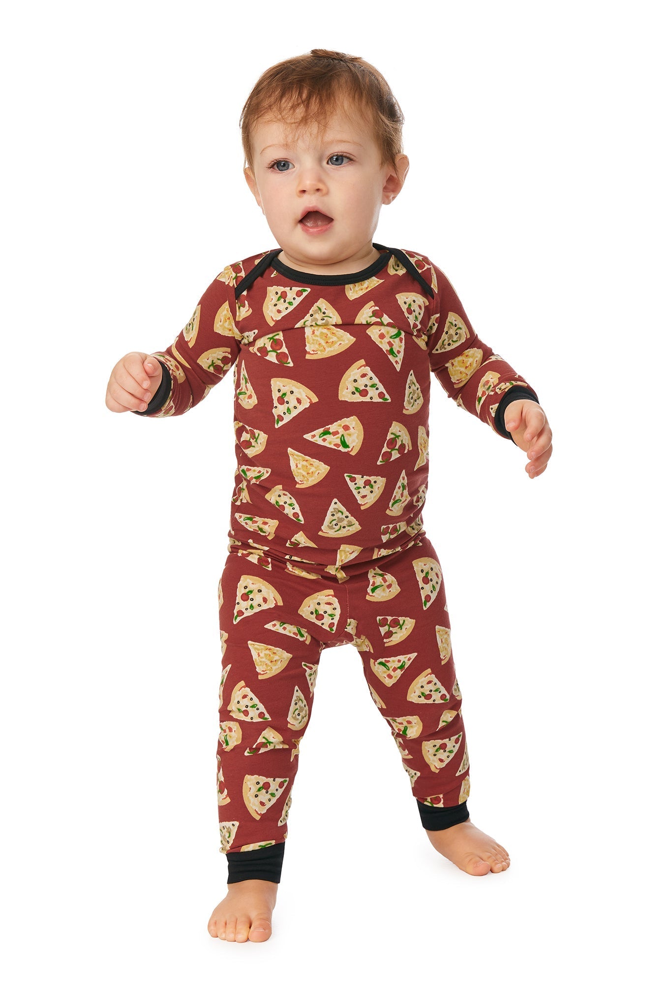 A baby wearing a brown long sleeve pj set with pizza pattern.