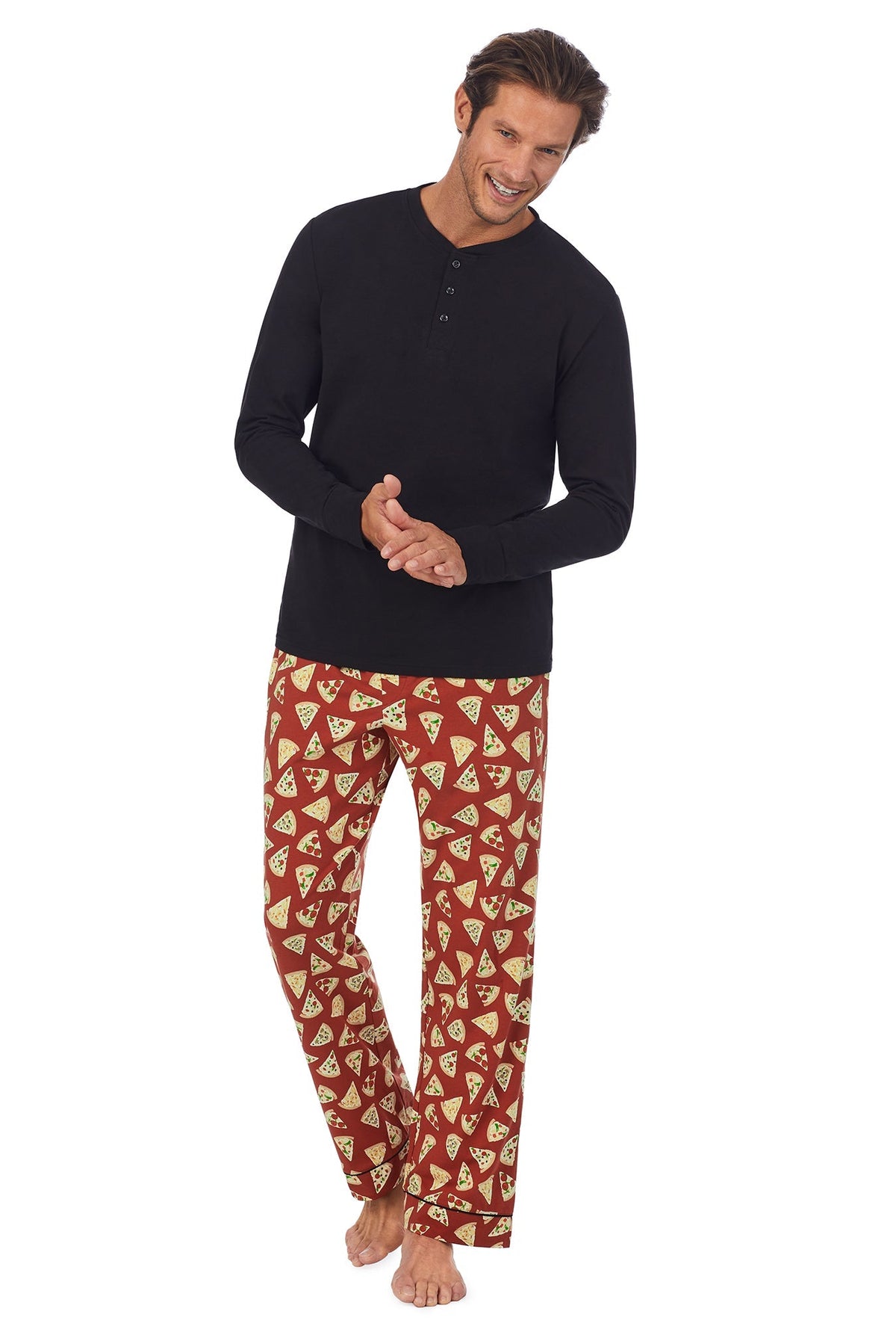 A man wearing a black long sleeve jersey and brown long bottom pj set with pizza pattern.