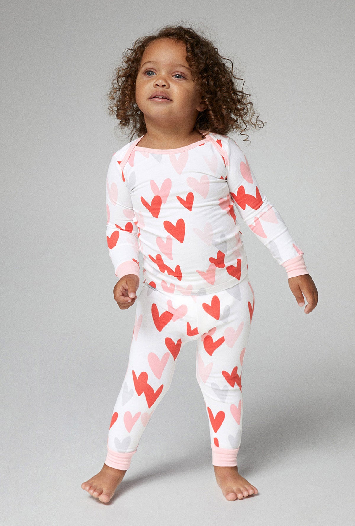 A toddler wearing long sleeve stretch jersey pj set