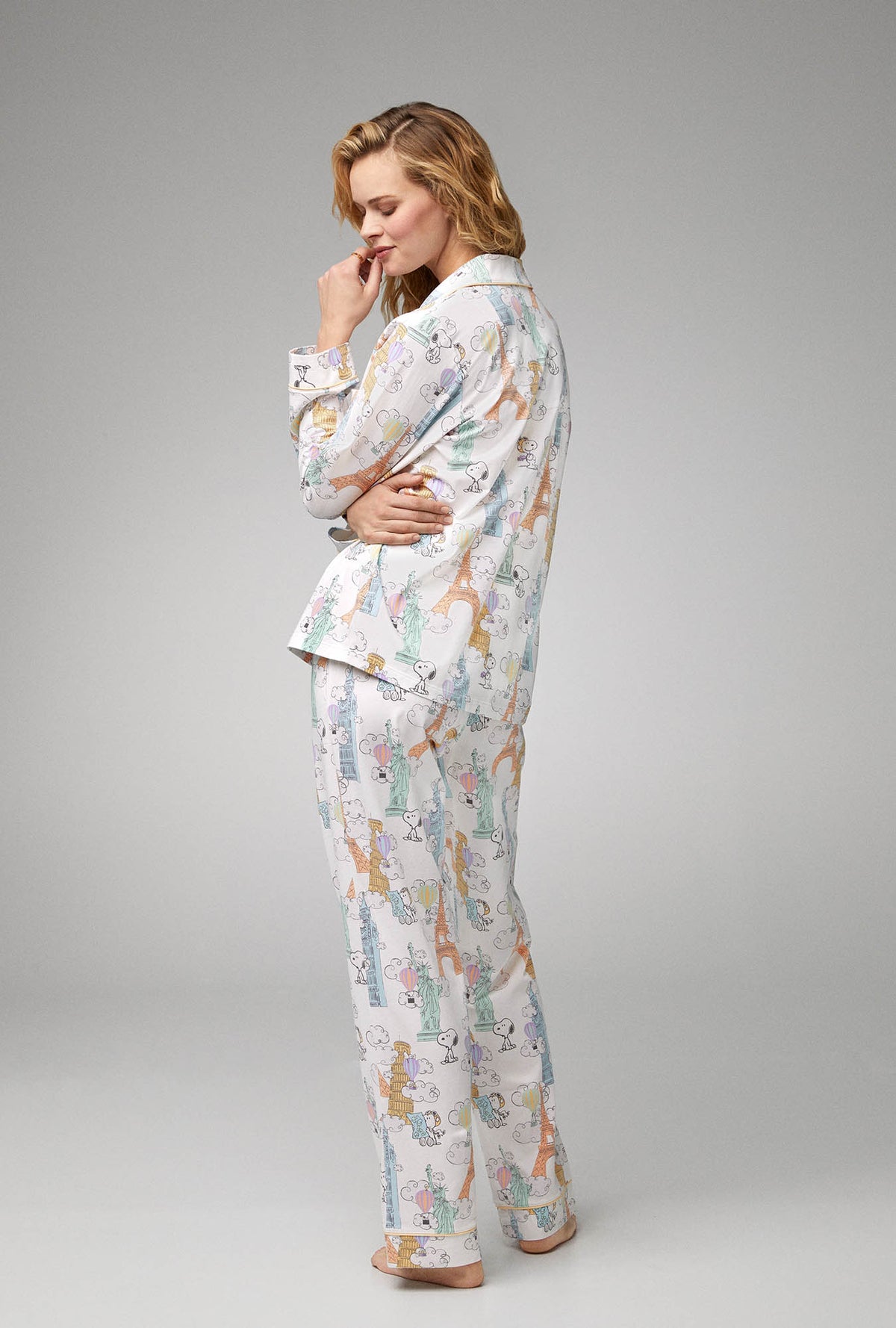 A lady wearing white  Long Sleeve Classic Stretch Jersey PJ Set with Bon Voyage Snoopy print