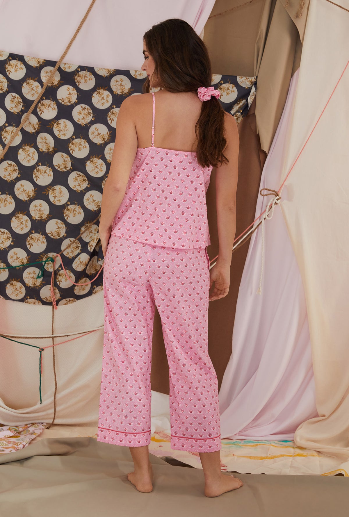 A lady wearing pink tank cropped pj set with corsage print