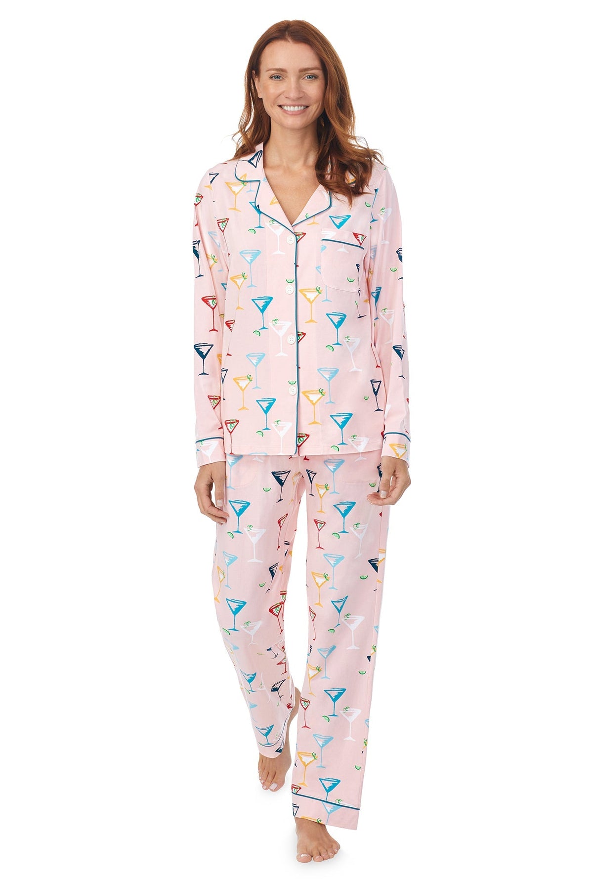 A lady wearing a pink long sleeve pj set with glass pattern.