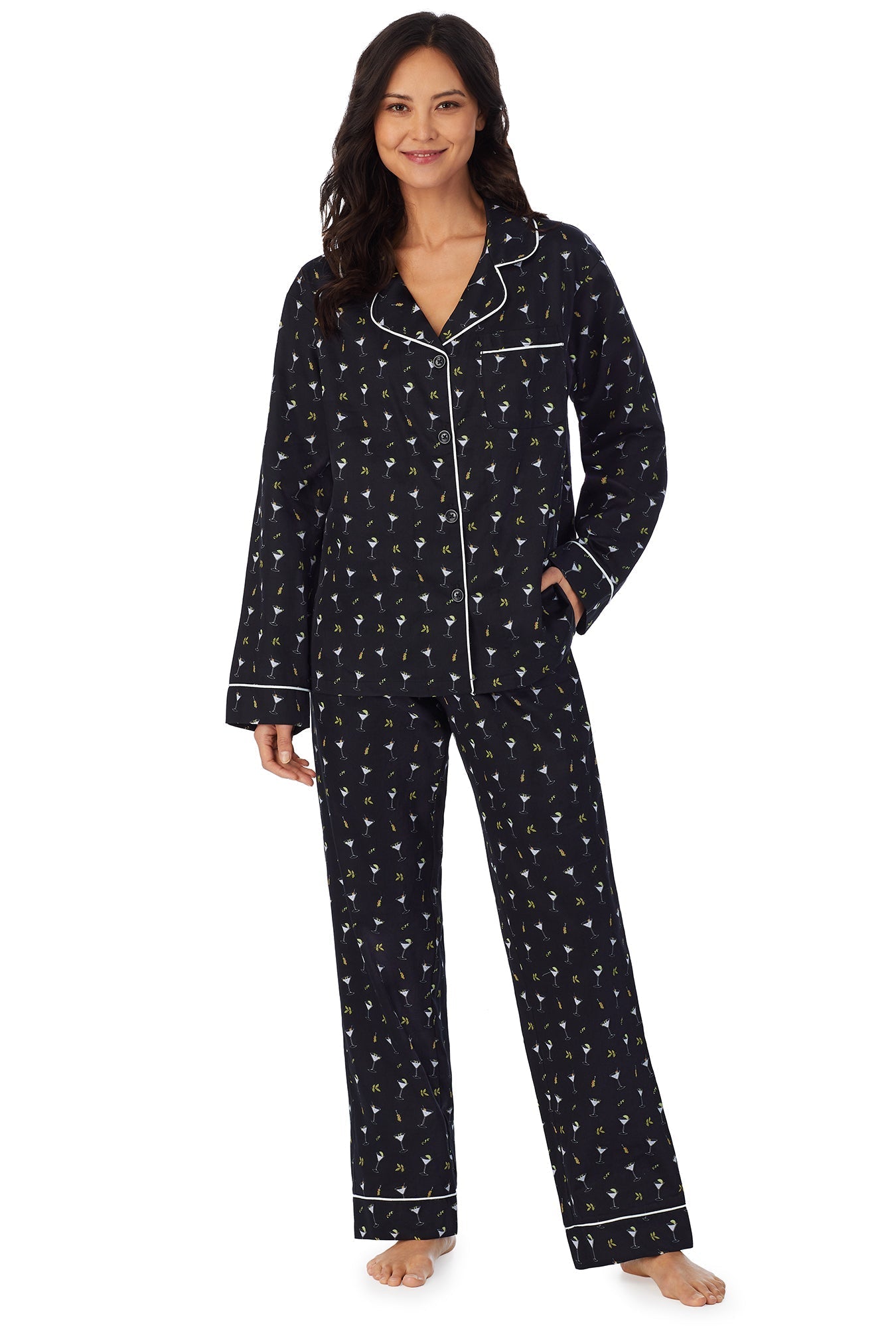 A lady wearing a black long sleeve pj set with tipsy martini pattern.