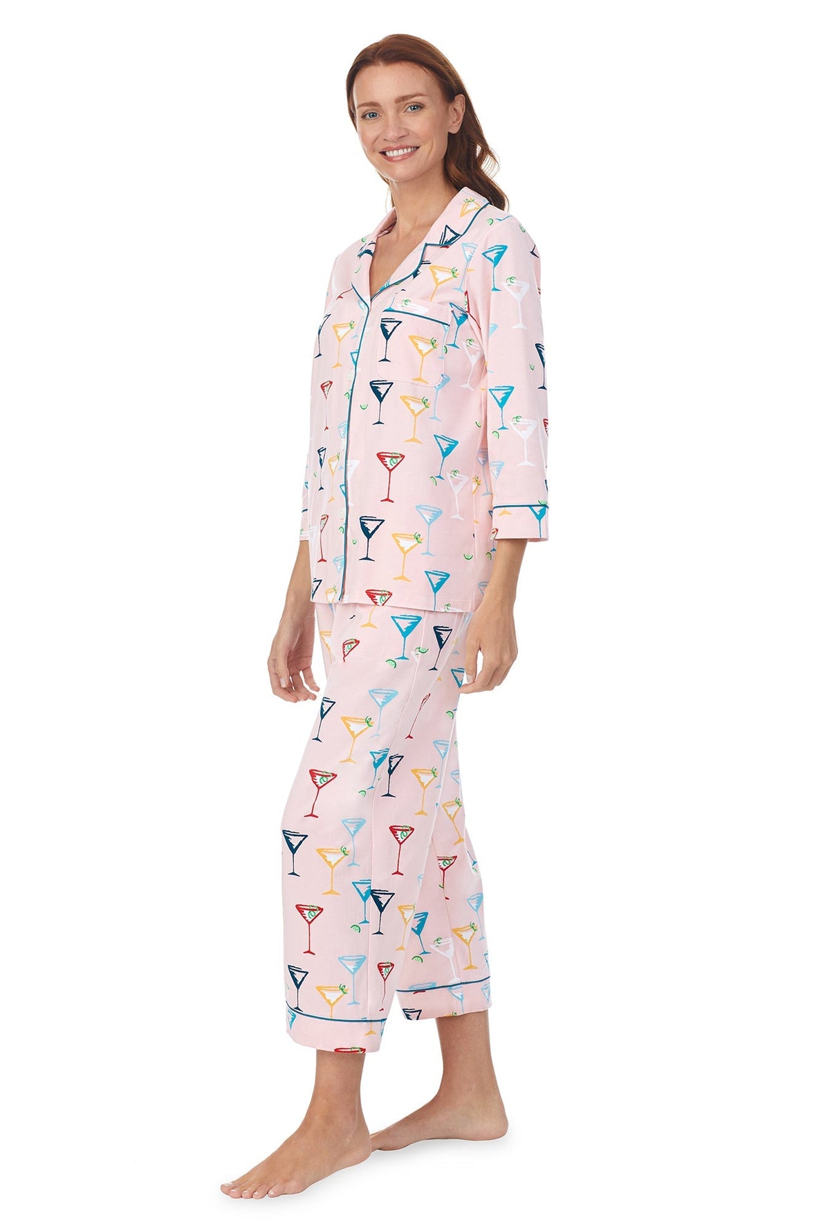 A lady wearing a pink quarter sleeve cropped pj set with glass pattern.