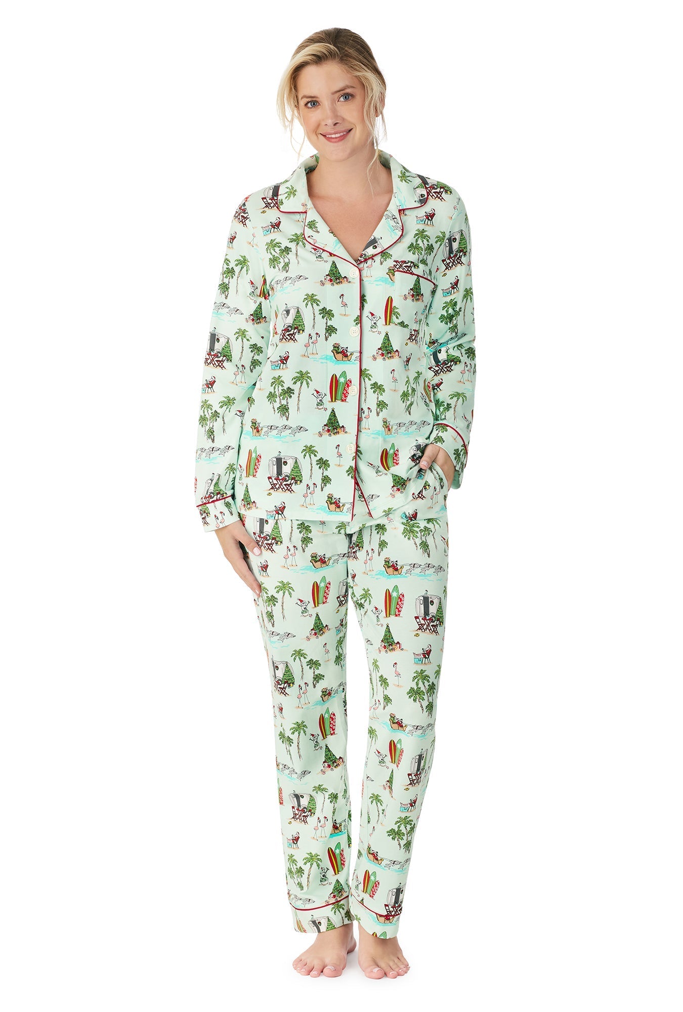 A lady wearing a green long sleeve pj set with beach pattern.