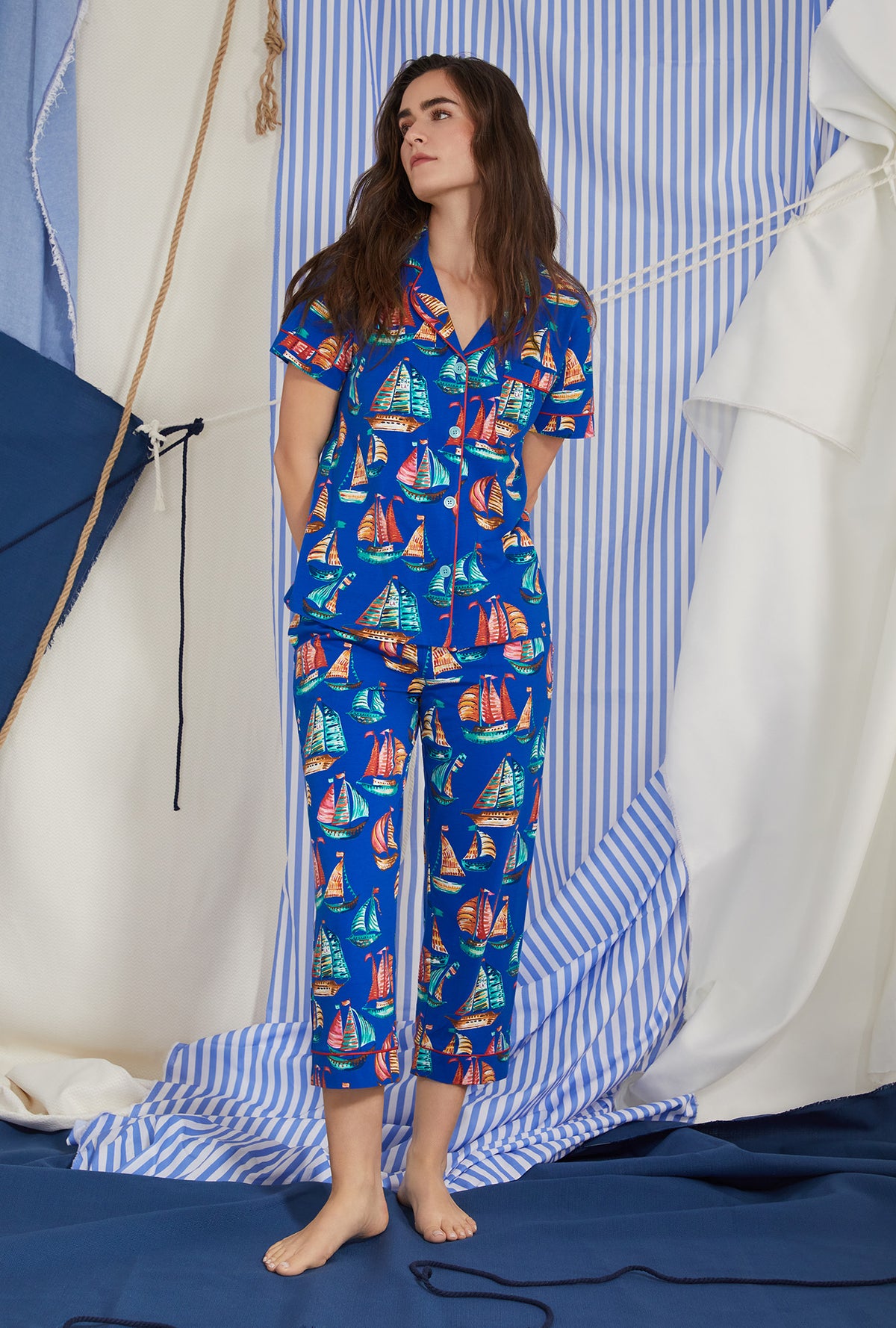A lady wearing blue short sleeve classic stretch jersey cropped pj set with co sail away print.